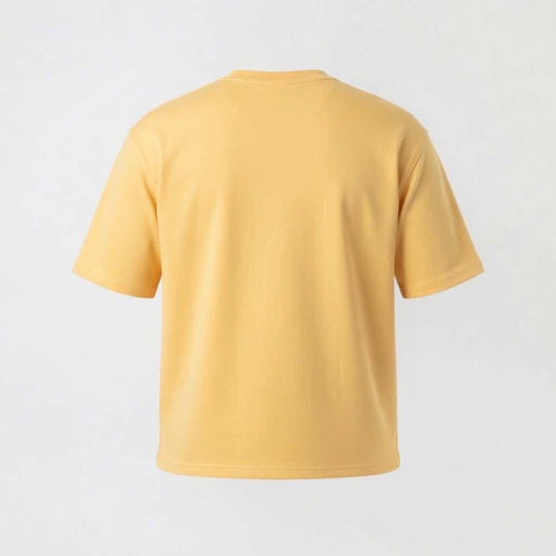Back perspective of the Butter Yellow structured streetwear t-shirt, showcasing the clean drape of the heavyweight shape-retaining fabric.